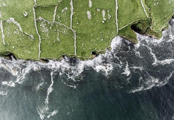 Aerial view of fields cliffs sea